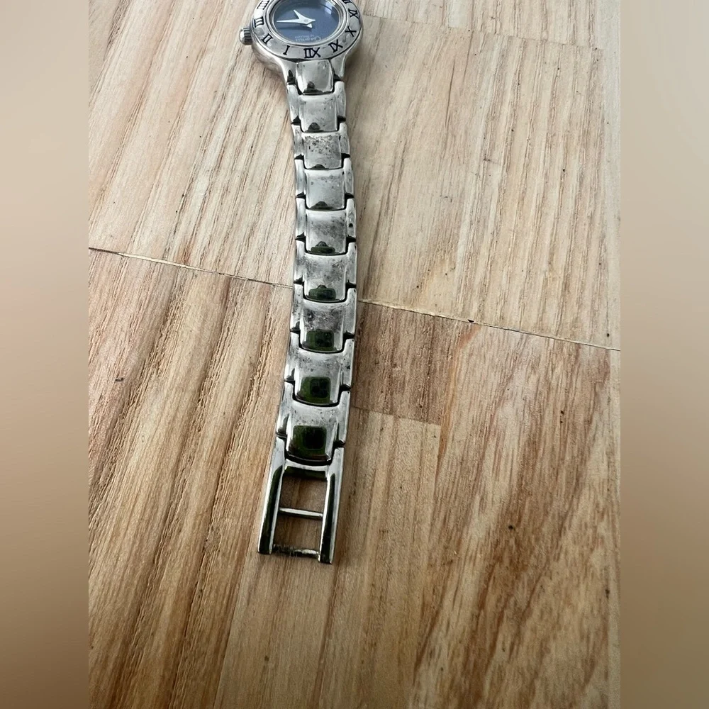 Caravelle by Bulova ladies blue dial silver tone dress watch NEW BATTERY